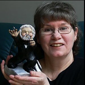Brenda Newton and her custom clay caricature of Dale Wood