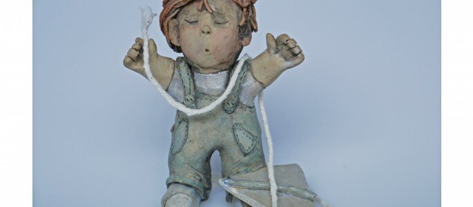"Boy with kite" clay caricature by Brenda Newton